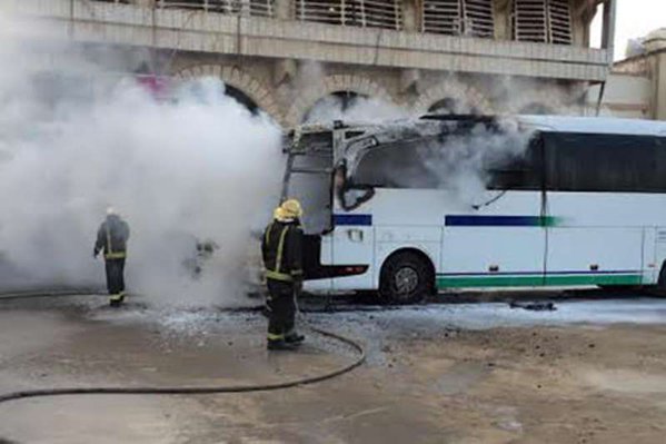 Armed men set Saudi Aramco bus on fire