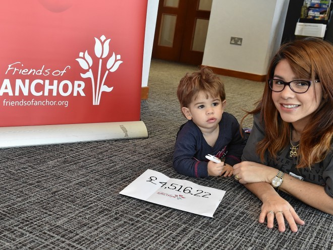 Patricia Bruce with son Daniel, 21 months, visited Friends of Anchor to hand over a cheque for almost £5000 raised from a Christmas charity lights event , organised by friends and neighbours on their street in Stonehaven