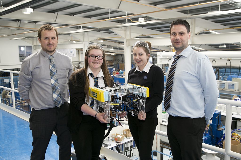 Ali Hynd, principal head of technology for Mintlaw Academy, with Erin Kindness (15) and Joanne McDonald (15) of Mintlaw Academy, and Craig Reid, production manager Hydro Group.