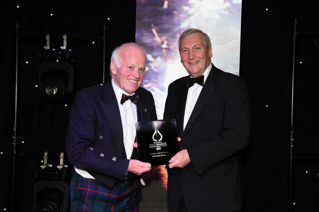 Jim Milne, chairman and managing director of Balmoral Group, being presented with an award by former Offshore Contractors Association chief executive Bill Murray at the 2015 Gold Awards.
