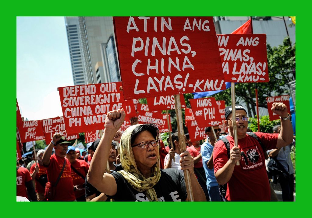 Anti China protesters mount a rally against China's territorial claims in the Spratlys group of islands in the South China Sea in front of the Chinese Consulate on July 12, 2016 in Makati, Philippines.