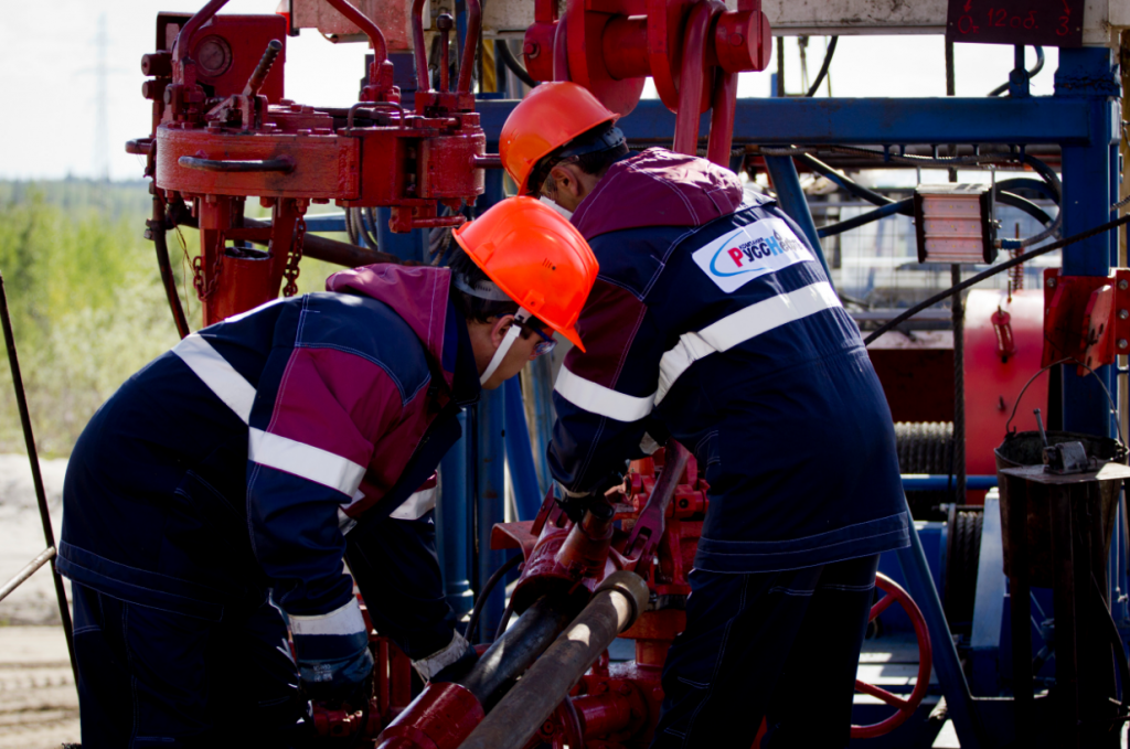 Russneft employees working on an installation