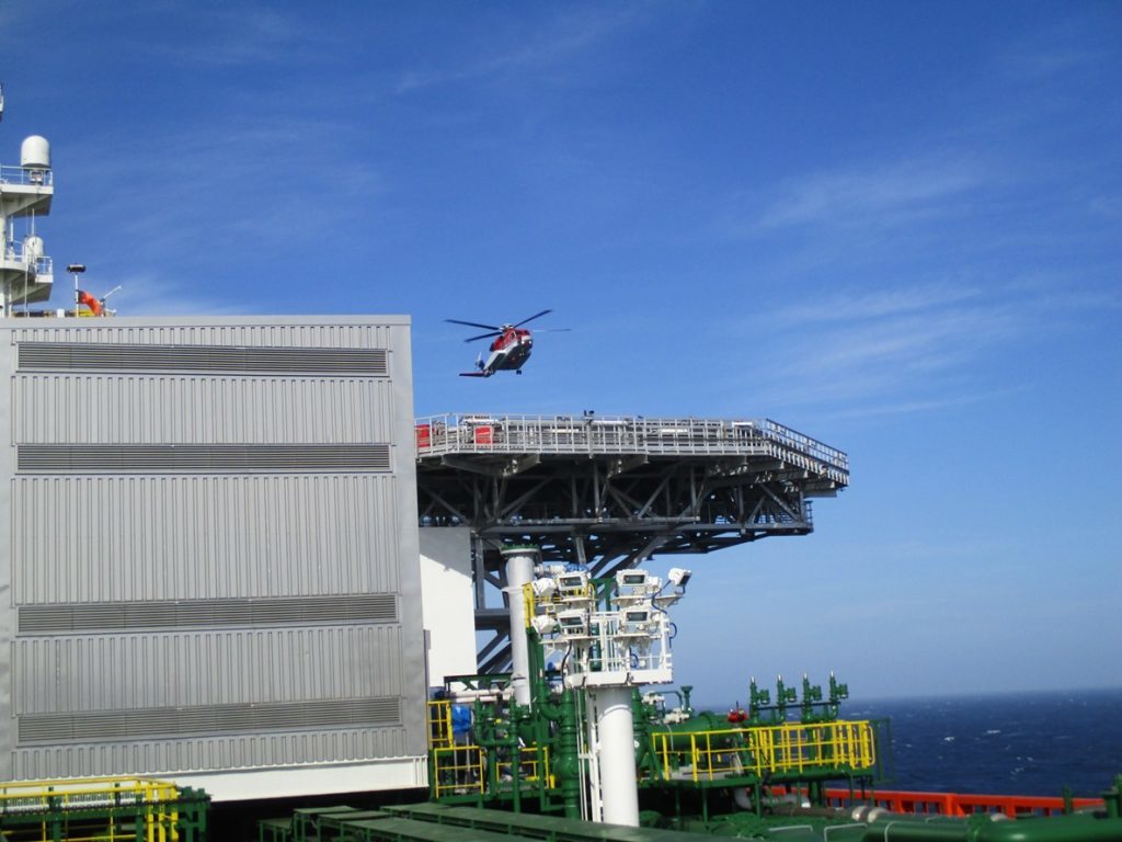 The helicopter arriving on the helideck
