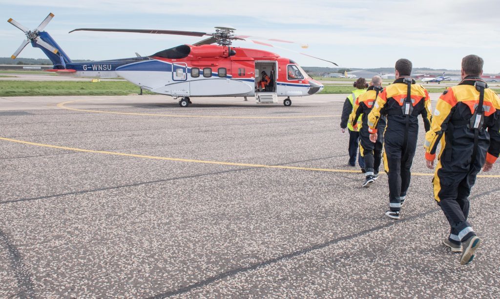 Oil workers boarding a CHC Helicopter operated S92 aircraft