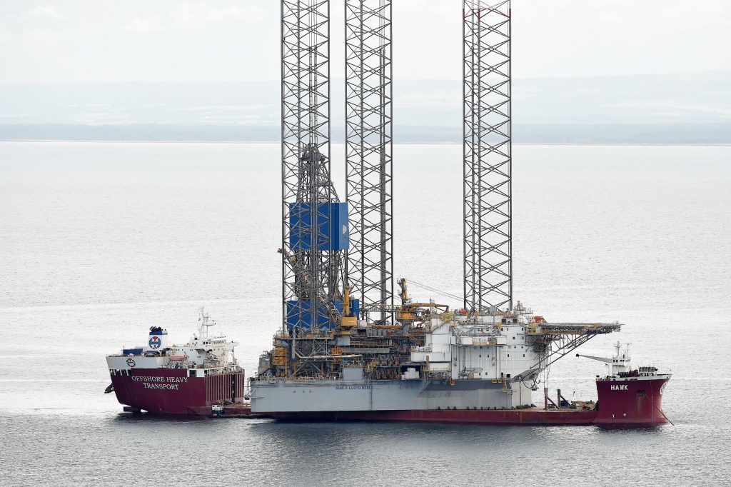 The large jack up oil rig 'Noble Lord Noble' sits on the deck of the Norwegian heavy lift ship 'Hawk' in the Moray Firth before entering the Cromarty Firth yesterday (Fri).