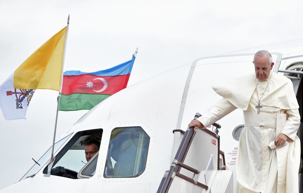 Pope Francis disembarks from a plane that brought him to Azerbaijan's capital Baku, Sunday, Oct. 2, 2016.