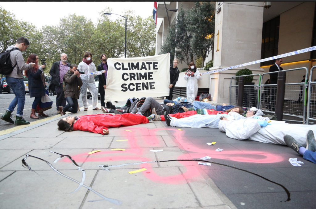 Protesters have created a crime scene outside an oil conference