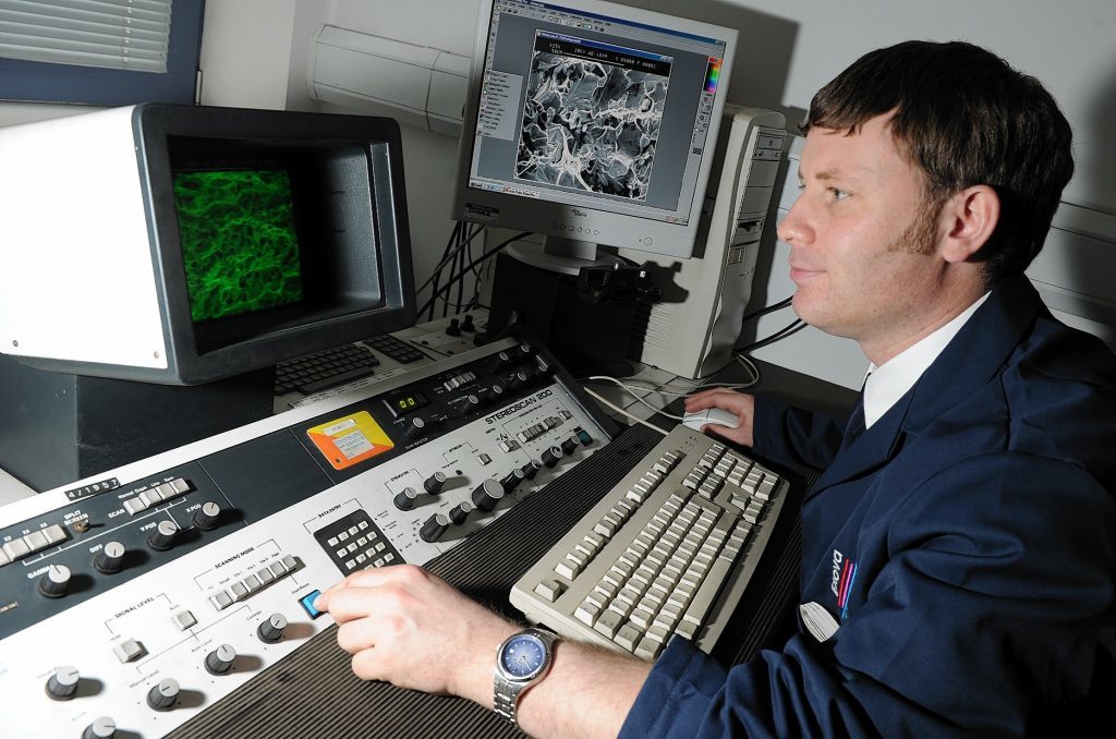 Derek Sharp, Exova Senior Lab Technician working on a Scanning Electron Microscope in their newly opened lab at Wellheads Way, Dyce.