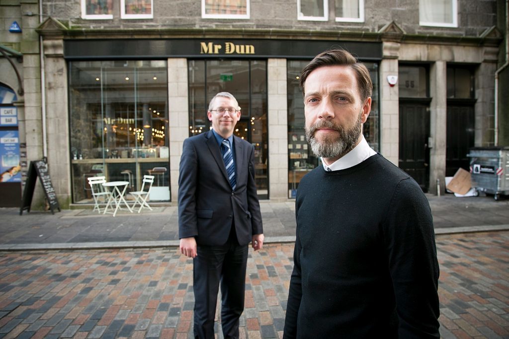 Owner, Dean Walker, in foreground and Douglas Henderson, regional manager at Bank of Scotland in background