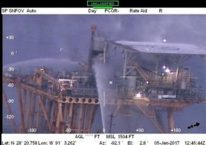 A photogrpah showing water being sprayed on the platform. Coast Guard imagery courtesy of Coast Guard Aviation Training Center Mobile