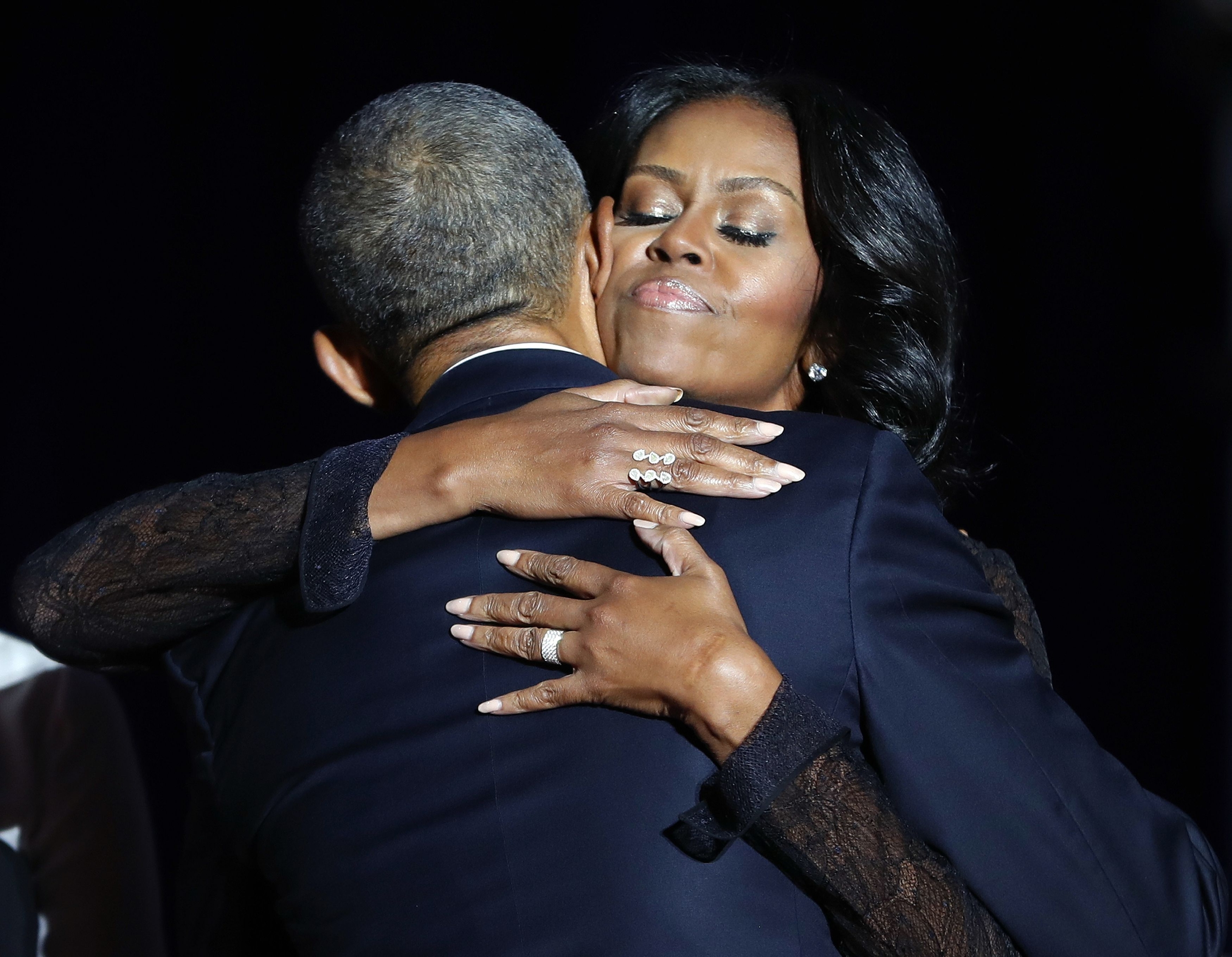 First lady Michelle Obama hugs President Barack Obama after his farewell address at McCormick Place in Chicago,