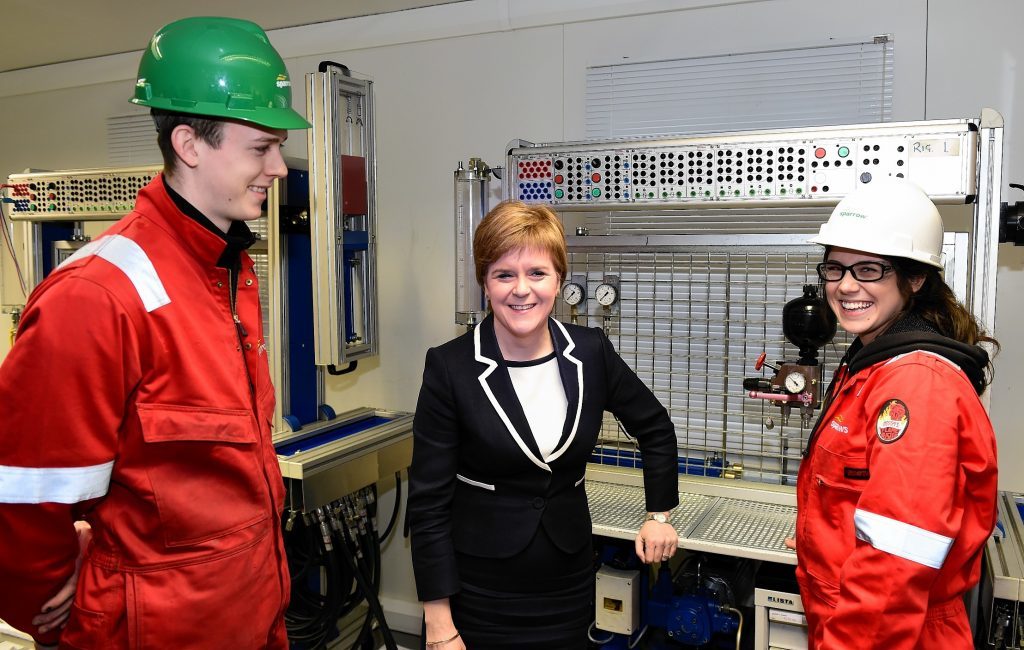 First Minister Nicola Sturgeon at Sparrows Training Centre, with apprentice's Leanne Brown and Adam Clark (left).