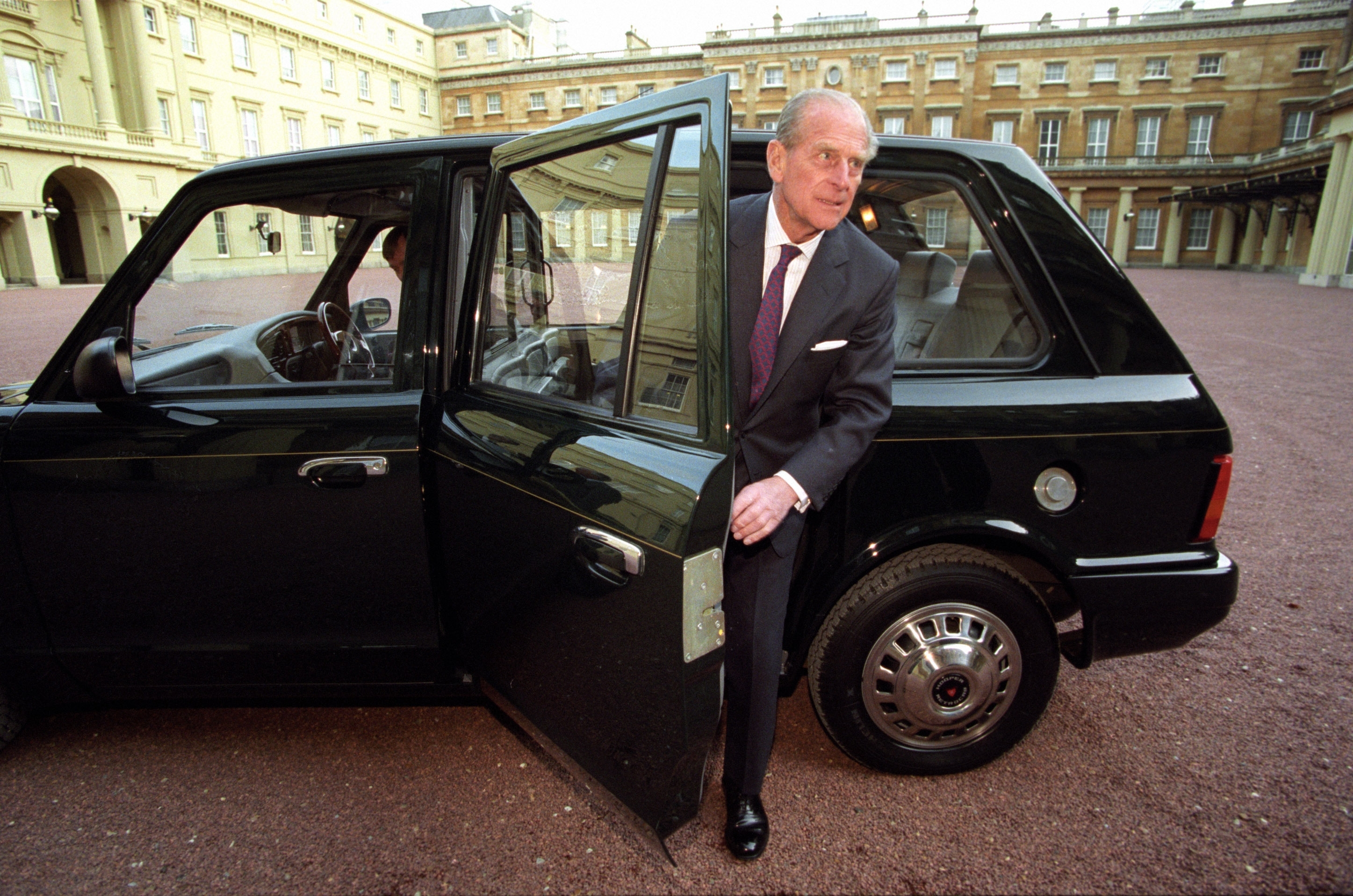 The Duke of Edinburgh with his Metrocab taxi at Buckingham Palace in London as the eco-friendly taxi will go on display after almost two decades of royal service.