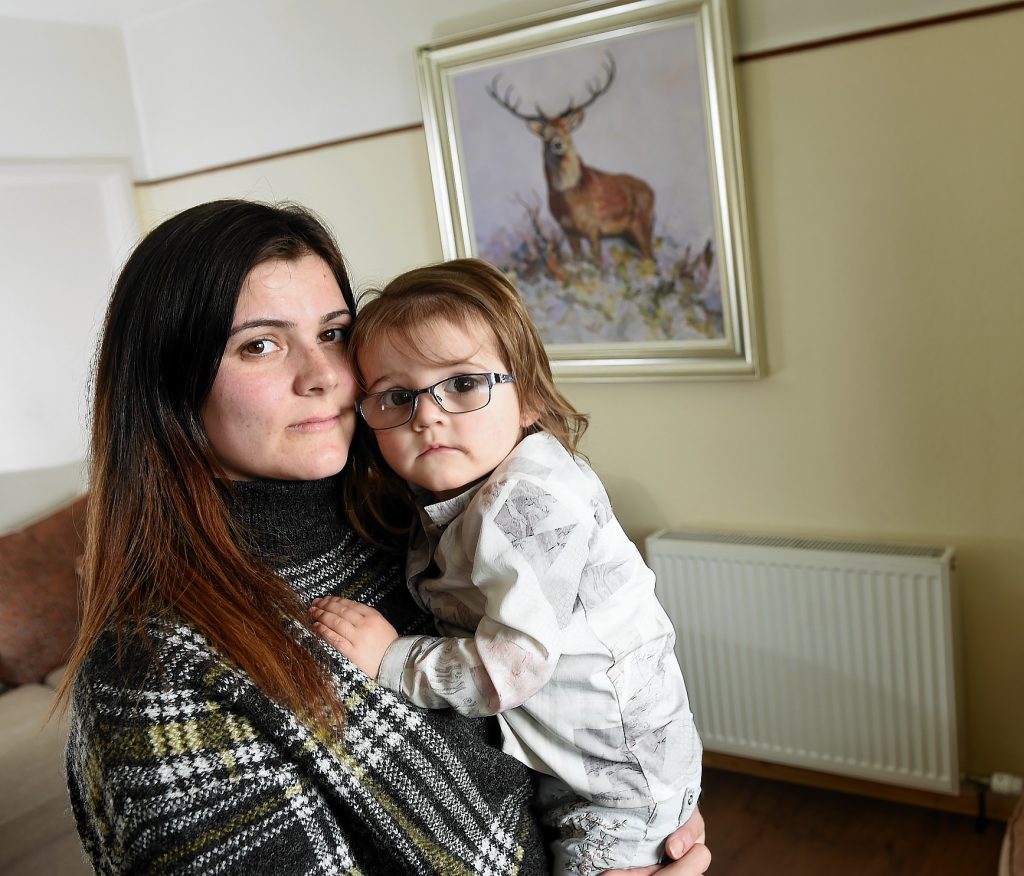 Lisa Ross of Kessock Road, Inverness with her daughter Layla (2), who is having her radiators replaced along with dozens of other residents in South Kessock following the installation of ones of the wrong size.