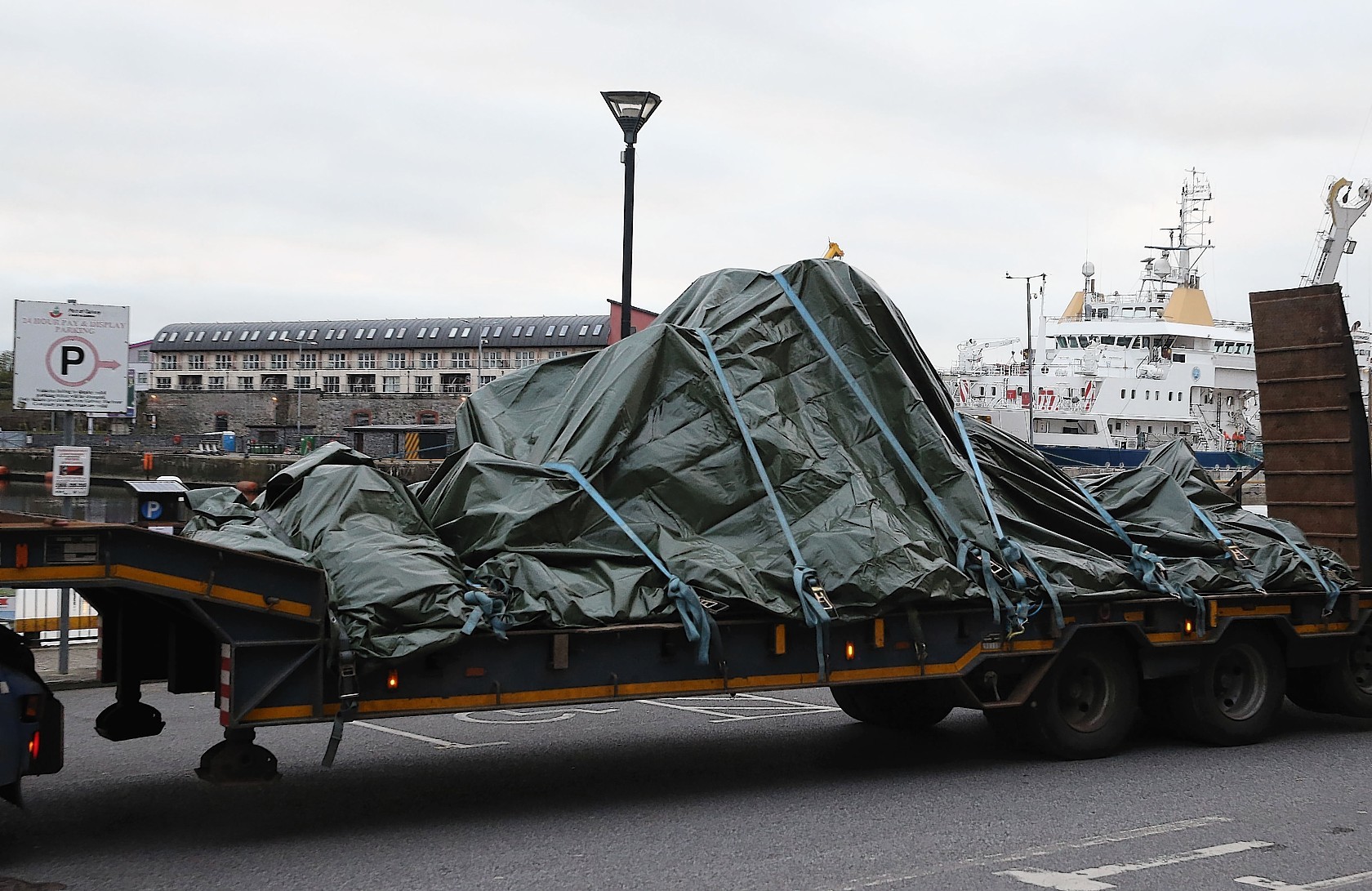 The wreckage of the Irish Coast Guard helicopter, callsign Rescue 116, which crashed off the west coast of Ireland on March 14, leaves Galway harbour on a flat bed truck after the aircraft was recovered from the seabed near Blackrock. Photo credit  Brian Lawless/PA Wire