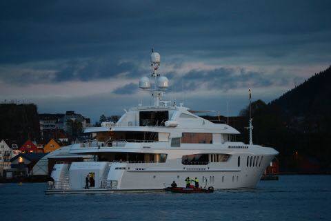The superyacht Bacarella surrounded by rescuers