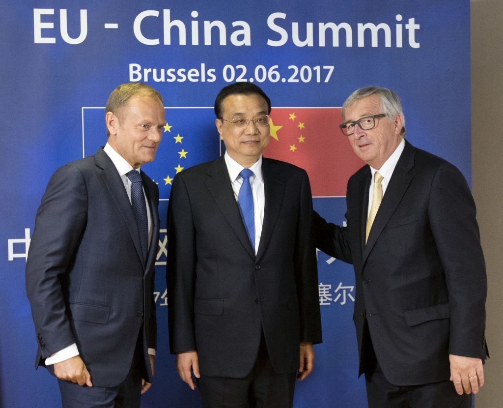 European Commission President Jean-Claude Juncker, right, and European Council President Donald Tusk, left, pose with Chinese Premier Li Keqiang prior to a meeting at the EU-China summit in Brussels, on Friday, June 2, 2017. (Olivier Hoslet, Pool Photo via AP)