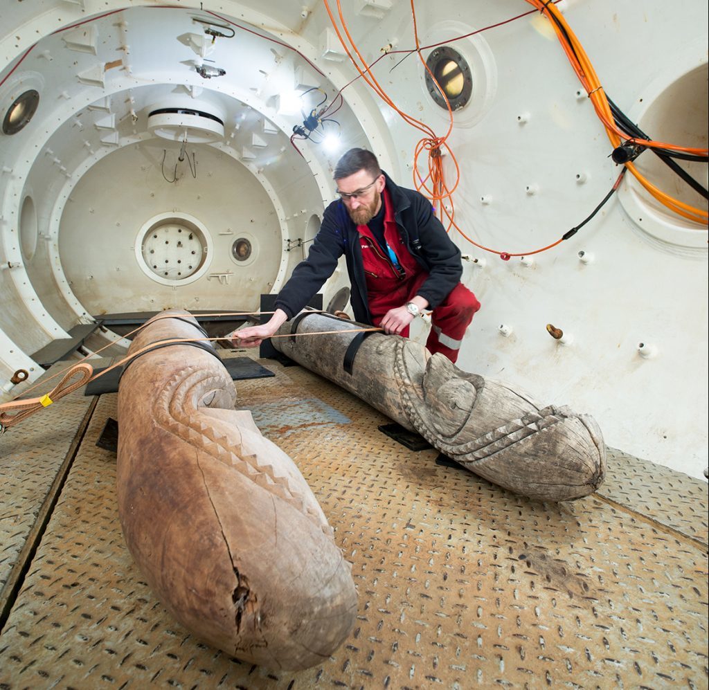 A JFD technician ensures the sculptures are secure prior to testing