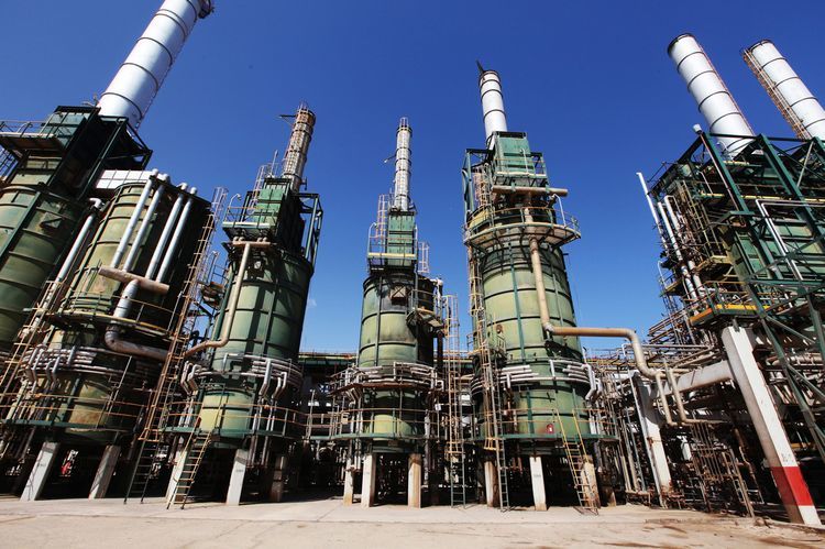 Refining towers are seen at the Zawiya oil refinery near Tripoli, Libya. Photographer: Shawn Baldwin/Bloomberg