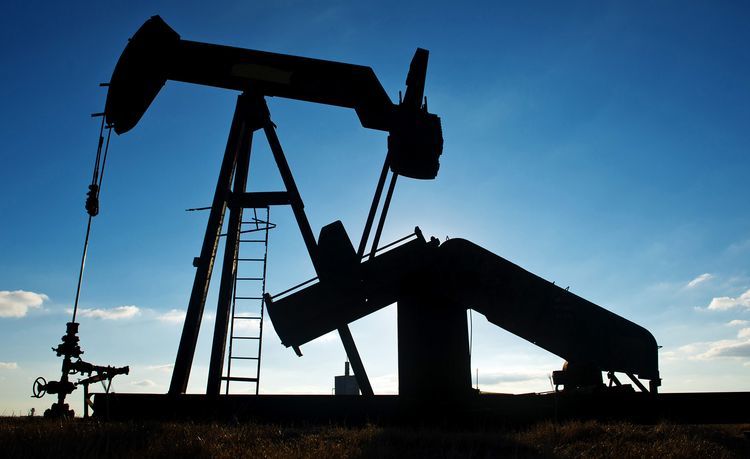 A pump jack operates in an oil field near Corpus Christi, Texas. Photographer: Eddie Seal/Bloomberg