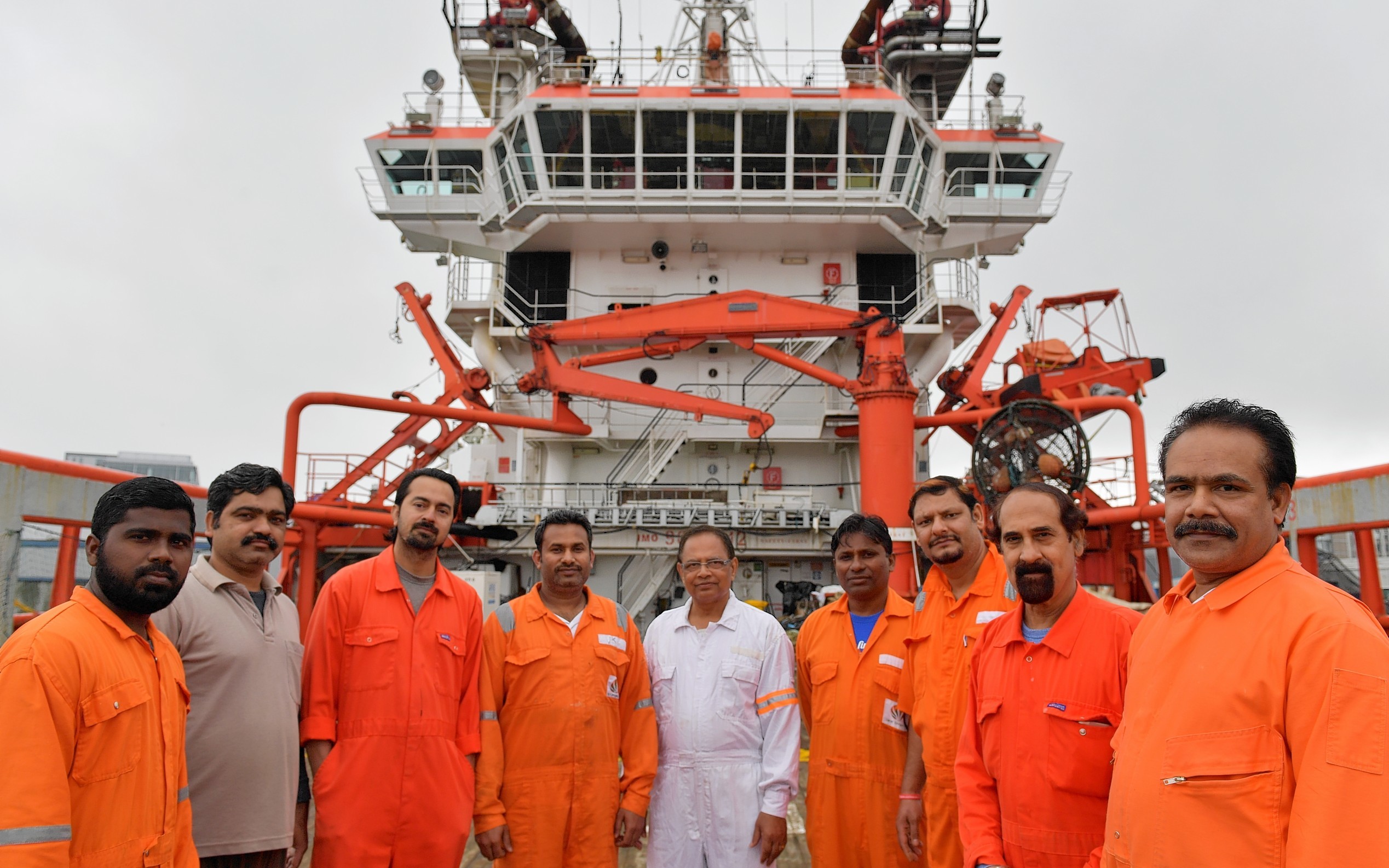 The crew of the Indian owned Malaviya Seven offshore vessel which has been detained in Aberdeen since last year for non payment of wages, are waiting on a court hearing which could decide if they can go home.   
Pictured - Some of the twelve man crew on the vessel.