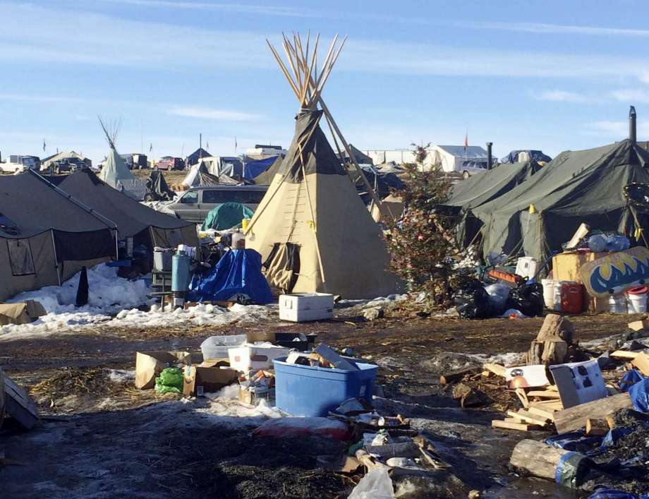 Debris is piled on the ground awaiting pickup by cleanup crews at the Dakota Access oil pipeline protest camp in southern North Dakota near Cannon Ball. The camp is on federal land, and authorities have told occupants to leave by Wednesday, Feb. 22 in advance of spring flooding.