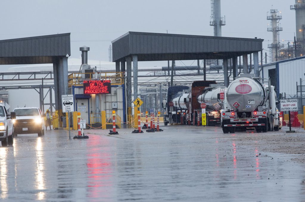 Tanker trucks enter a refinery ahead of Hurricane Harvey in Texas City, on Aug. 25.