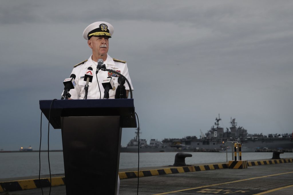 Commander of the U.S. Pacific Fleet, Scott Swift answers questions during a press conference with the USS John S. McCain and USS America docked in the background at Singapore's Changi naval base on Tuesday, Aug. 22, 2017