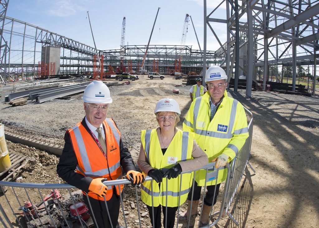 Council leader Jenny Laing with Bill Robertson, left, founder of the Robertson Group, and Nigel Munro, senior project manager at Henry Boot Developments