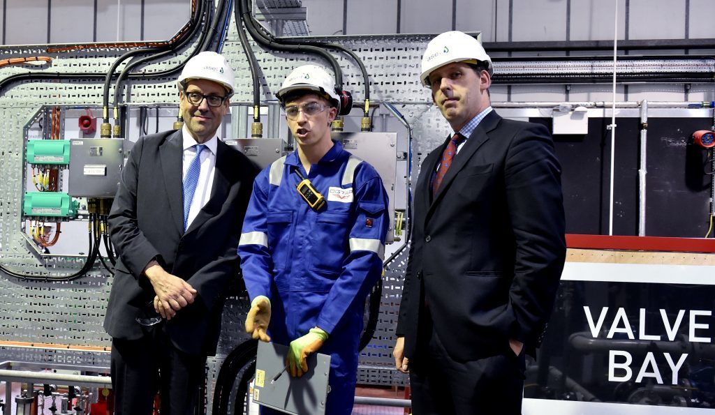 The UK energy minister Richard Harrington (left) visited the Aberdeen Skills and Enterprising Training (ASET) along with Lord Duncan of Springbank (right). They spoke to apprentice Ashley Thomas.
Picture by COLIN RENNIE  August 30, 2017.
