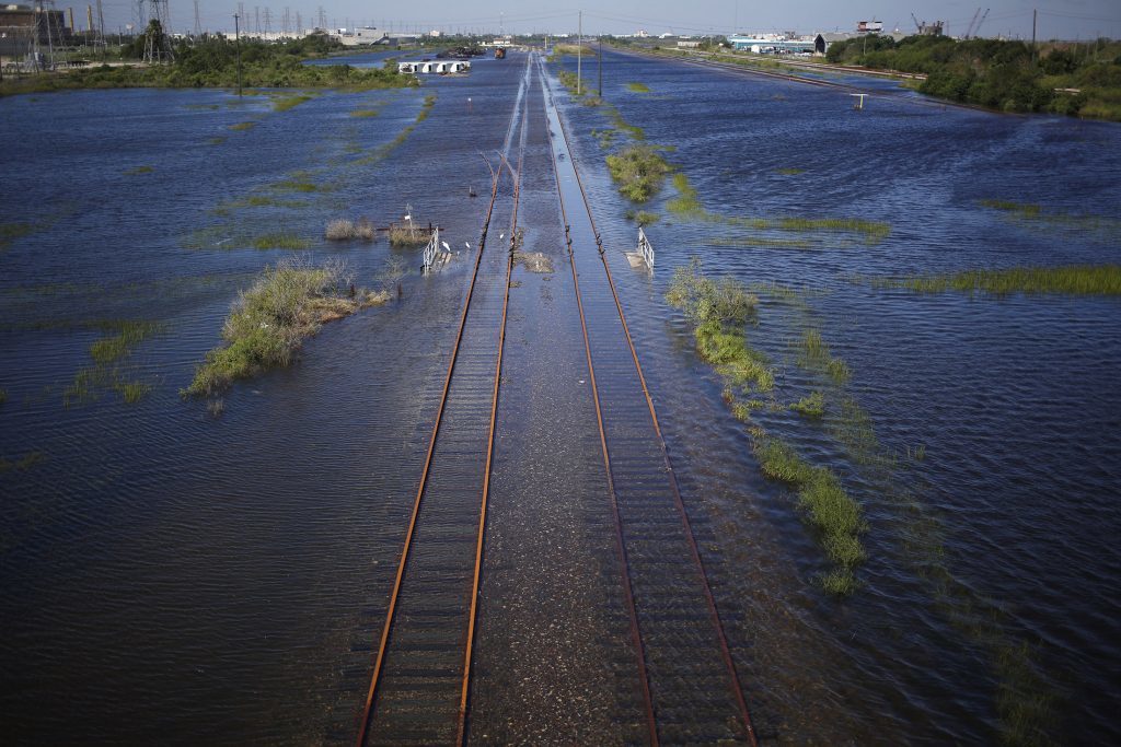Railroad tracks are seen covered in floodwaters from Hurricane Harvey in Galveston, Texas, U.S., on Wednesday, Aug. 30, 2017. Unprecedented flooding from the Category 4 storm that slammed into the state's coast last week, sendinggasoline pricessurging as oil refineries shut, may also set a record for rainfall in the contiguous U.S., the weather service said Tuesday. Photographer: Luke Sharrett/Bloomberg