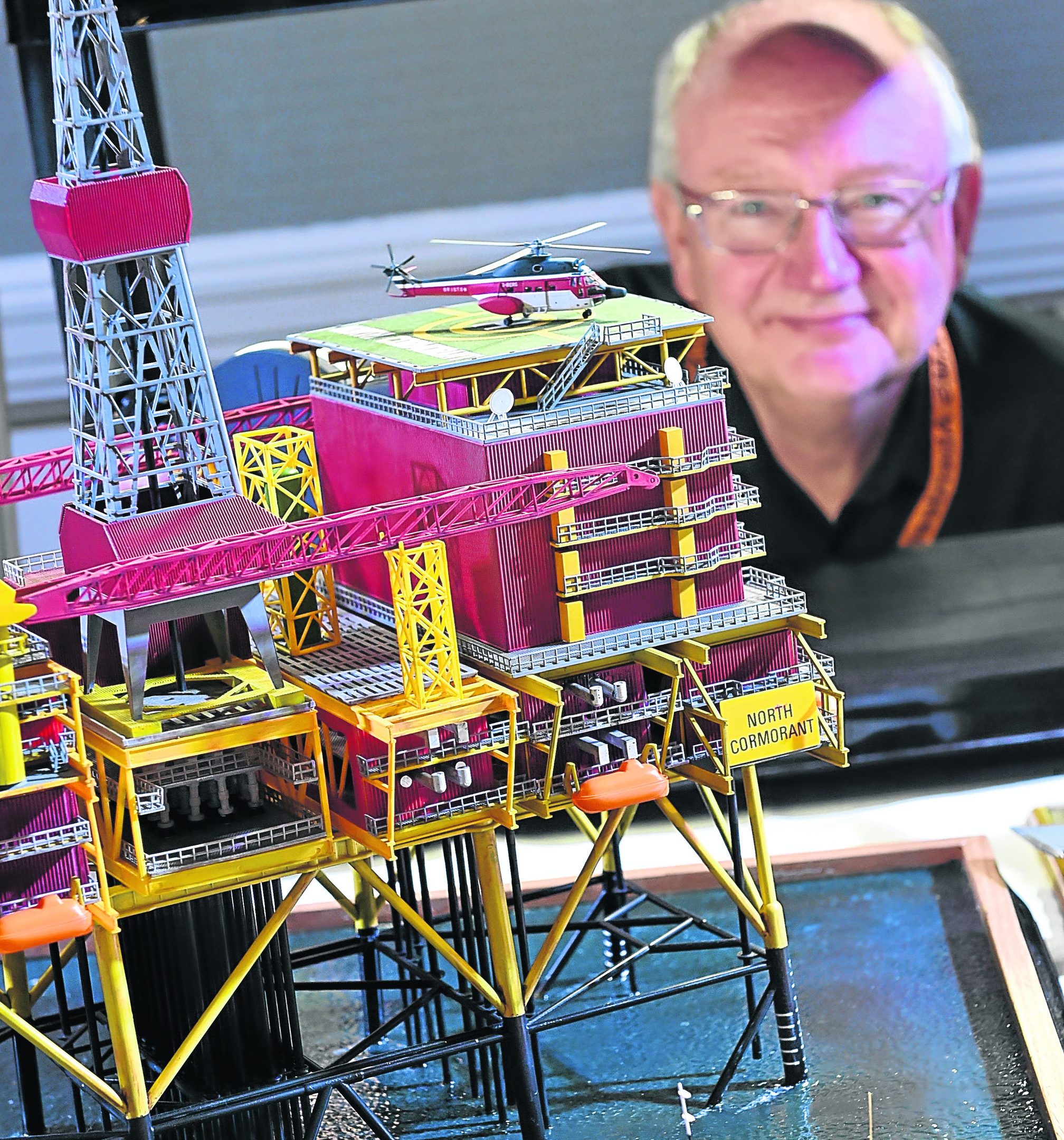 AMS Chairman George Scott with the club's model of the oil rig, North Cormorant .