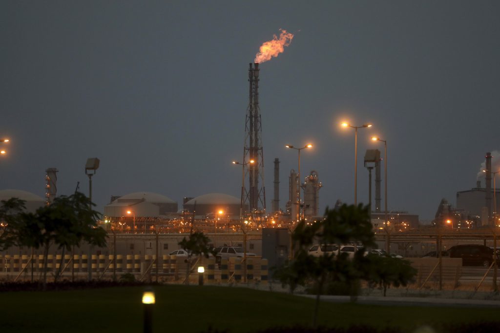 Lights illuminate the phosphate processing plant as a flame burns from a chimney at the Ras Al Khair Industrial City, operated by the Saudi Arabian Mining Co. (Ma'aden) in Ras Al Khair, Saudi Arabia, on Wednesday, Nov. 23, 2016. Photographer: Simon Dawson/Bloomberg