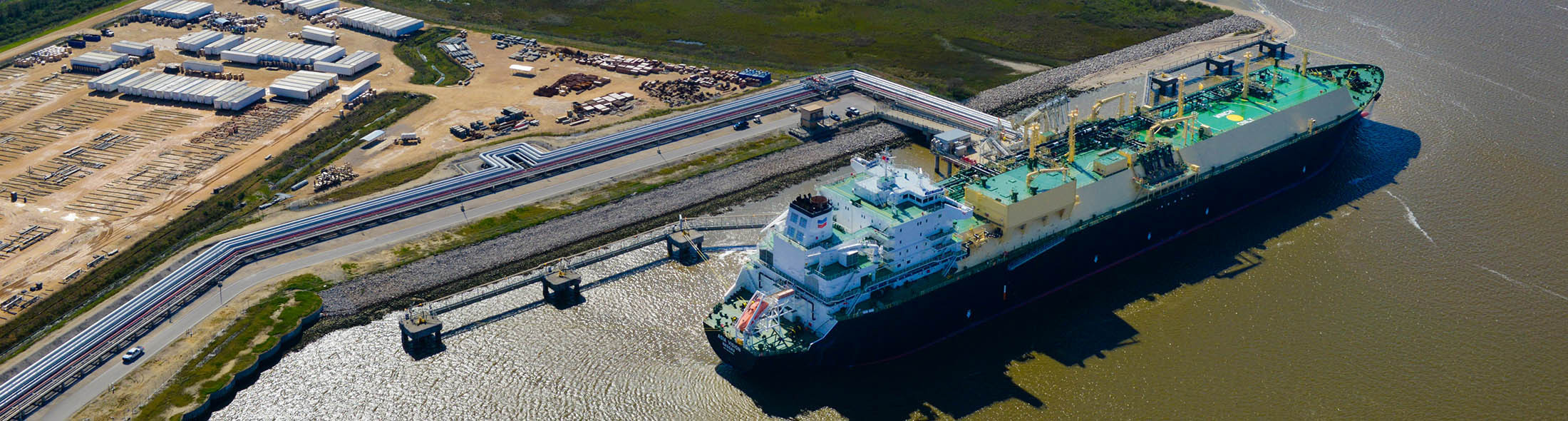 The Asia Vision LNG carrier ship sits docked at the Cheniere Energy Inc. terminal in this aerial photograph taken over Sabine Pass, Texas, U.S., on Wednesday, Feb. 24, 2016. Cheniere said in a statement last month. Cheniere Energy Inc. expects to ship the first cargo of liquefied natural gas on Wednesday to Brazil with another tanker to be loaded a few days later, marking the historic start of U.S. shale exports and sending its shares up the most in more than a month. Photographer: Lindsey Janies/Bloomberg