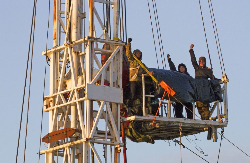 Photo issued by Yorkshire's Fracking Frontline of anti-fracking protesters who broke into a controversial site and scaled a rig.