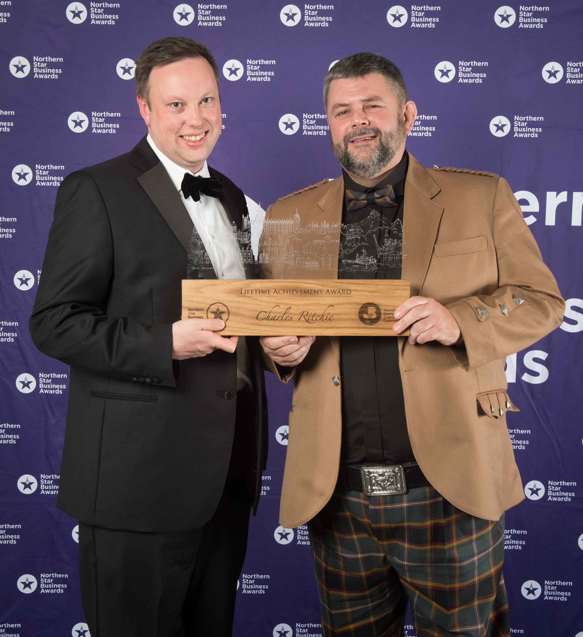 Conrad Ritchie, right, accepts the lifetime achievement award on behalf of his late father, Charles, with awards sponsor Fraser Carr from Cala Homes

Picture by Michal Wachucik / Abermedia