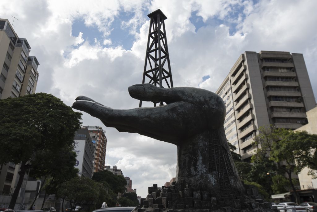 A sculpture, depicting an oil derrick in a hand, stands outside of the Petroleos de Venezuela SA (PDVSA) building ahead of government debt meetings in Caracas, Venezuela, on Monday, Nov. 13, 2017.