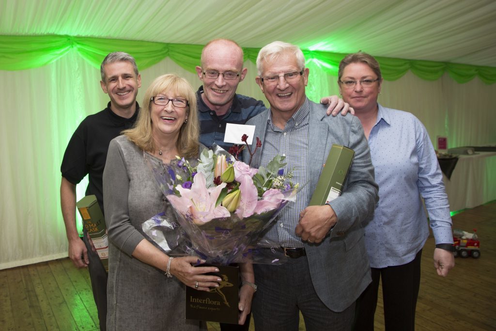 •	Founder John Bell and wife, Lynn Bell presented with gifts from long serving members of the JBP team.