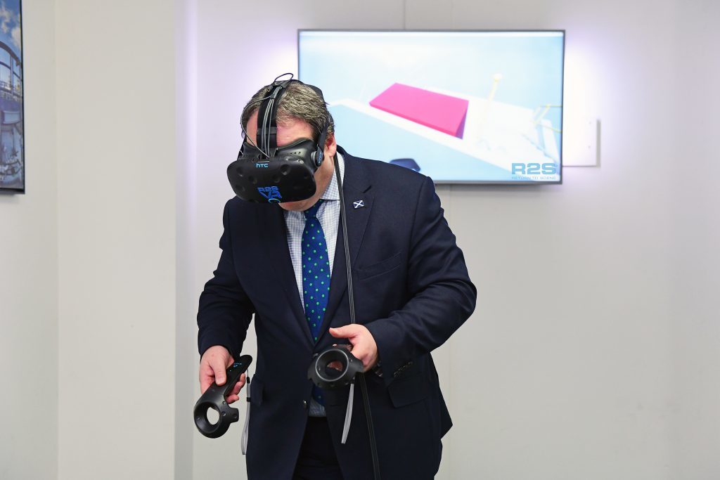 Paul Wheelhouse testing out virtual reality tech during his visit to Return To Scene