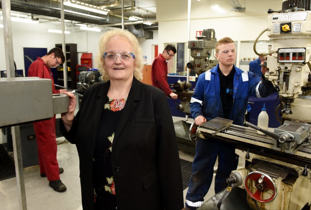 ITCA managing director, June Jones, with engineering apprentices working at their training facility in Kirkhill Industrial Estate, Dyce.