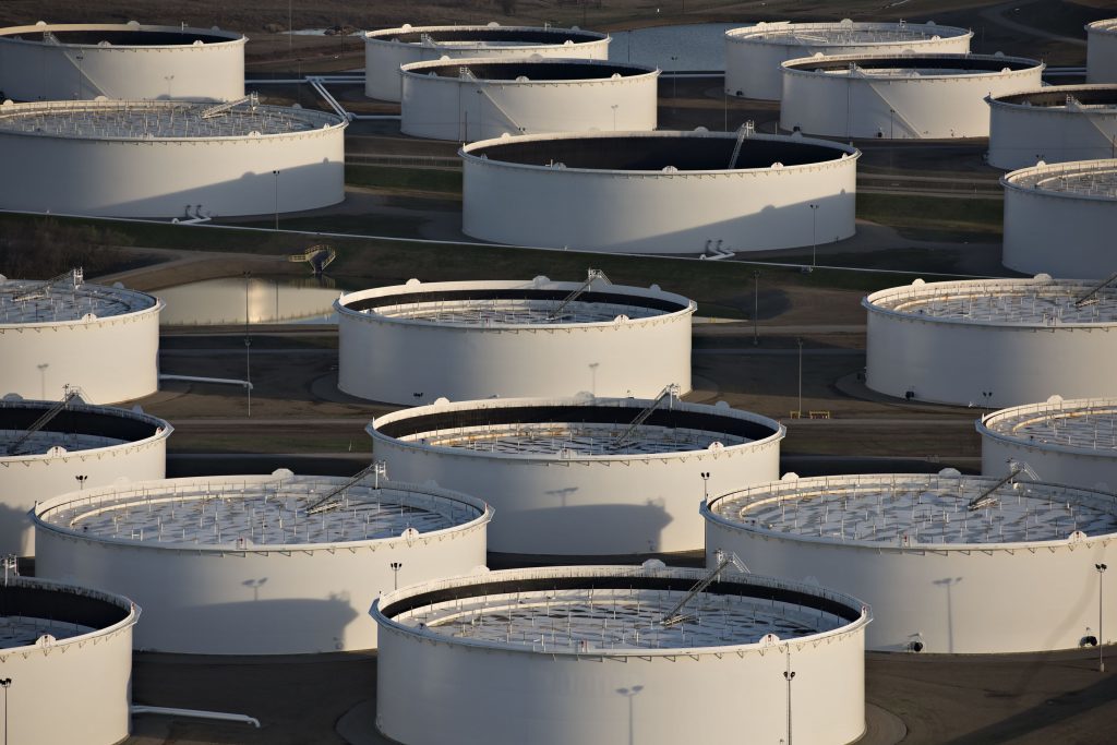 Oil storage tanks stand in this aerial photograph taken above Cushing, Oklahoma, U.S. Photographer: Daniel Acker/Bloomberg