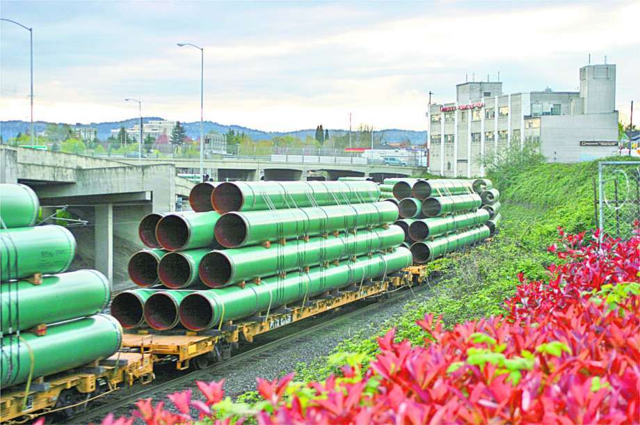 Pipe being transported by train. Kinder Morgan is the largest energy infrastructure company in North America. Kinder Morgan was named a Top Workplace.