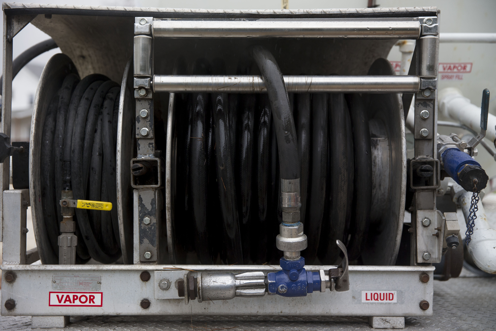 A fuel hose sits in its carrier on the back of a Michlig Energy liquid propane gas truck during delivery outside a home in Manlius, Illinois, U.S., on Monday, Dec. 14, 2015.  Photographer: Daniel Acker/Bloomberg