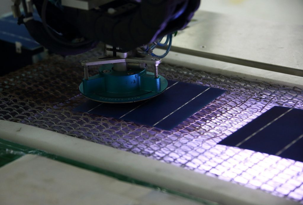 Solar cells move along the production line at the Trina Solar Ltd. factory in Changzhou, Jiangsu Province, China. Photographer:Tomohiro Ohsumi/Bloomberg