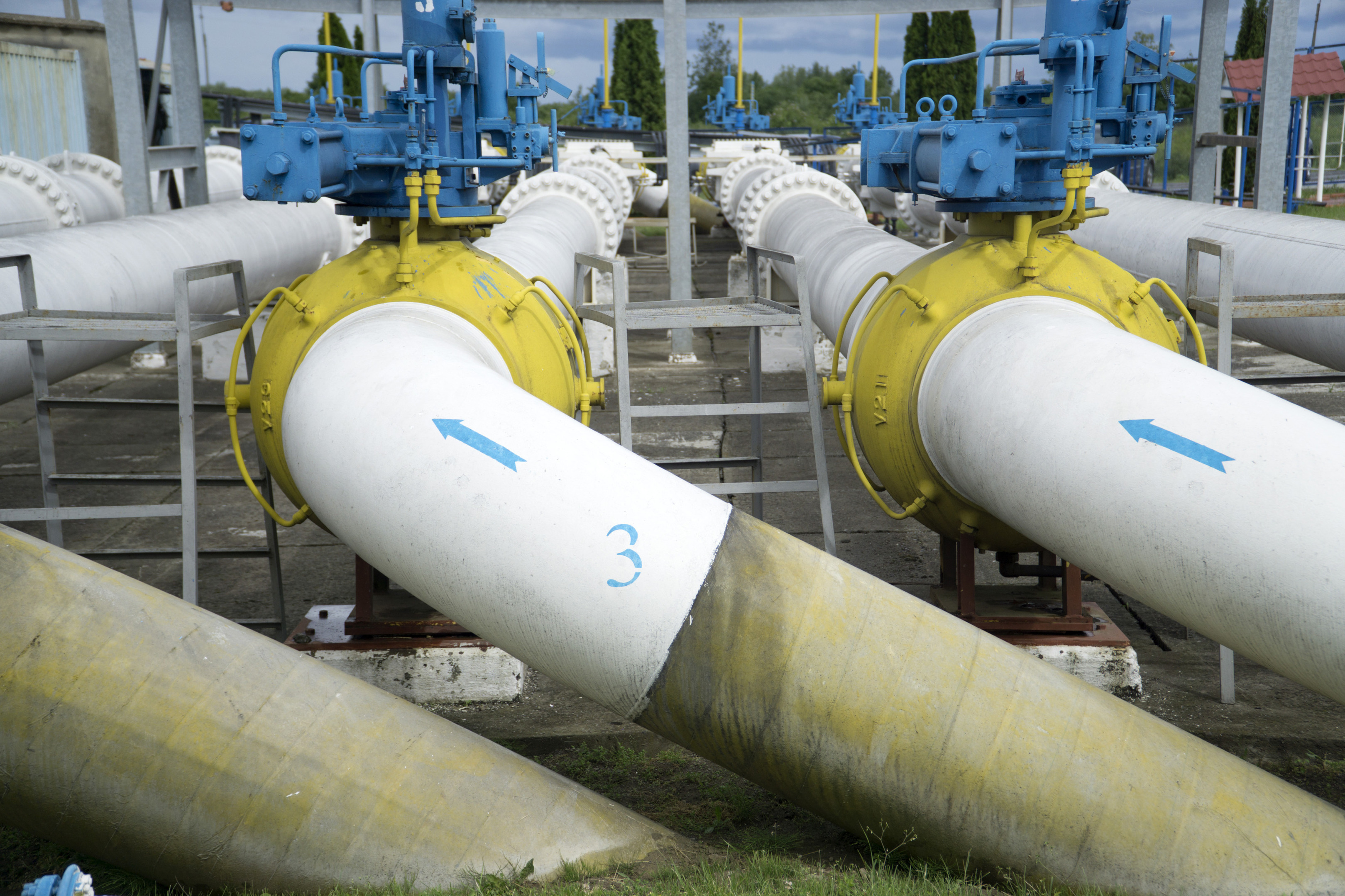 Flow direction arrows sit on trunk pipes at the gas metering station, operated by NAK Naftogaz Ukrainy, in Uzhgorod, Ukraine. Photographer: Vincent Mundy/Bloomberg