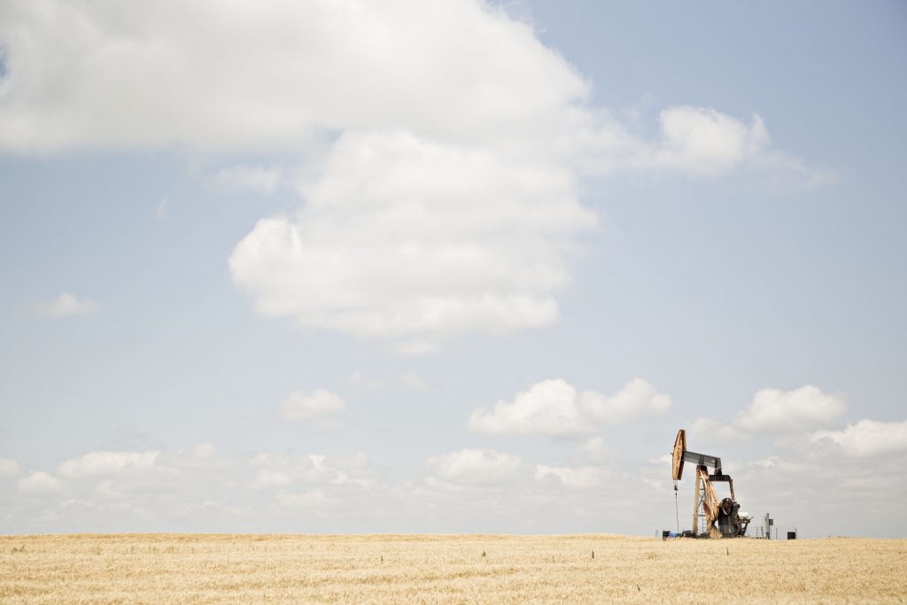 A pumpjack operates in the Bemis-Shutts oil field near Hays, Kansas, U.S., on Thursday, June 29, 2017. Photographer: Daniel Acker/Bloomberg