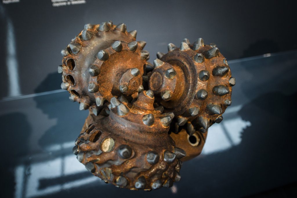 A rotary drilling bit used for oil exploration sits in an exhibition display at the Norwegian Oil Museum in Stavanger, Norway. Photographer: Kristian Helgesen/Bloomberg