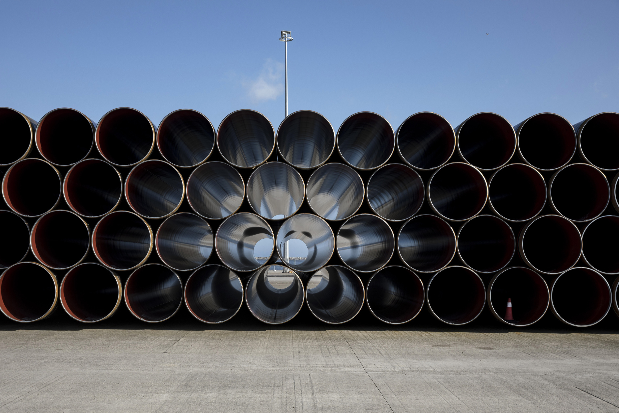 Pipe sections for the Trans Adriatic gas pipeline sit on the dockside at the cargo port of Alexandroupolis, Greece, on Feb. 23, 2017. The Trans Adriatic Pipeline AG (TAP) will transport Caspian natural gas to Europe crossing Northern Greece, Albania and the Adriatic Sea coming ashore in Southern Italy to connect the Italian gas network to the Trans Anatolian Pipeline (TANAP). Photographer: Konstantinos Tsakalidis/Bloomberg