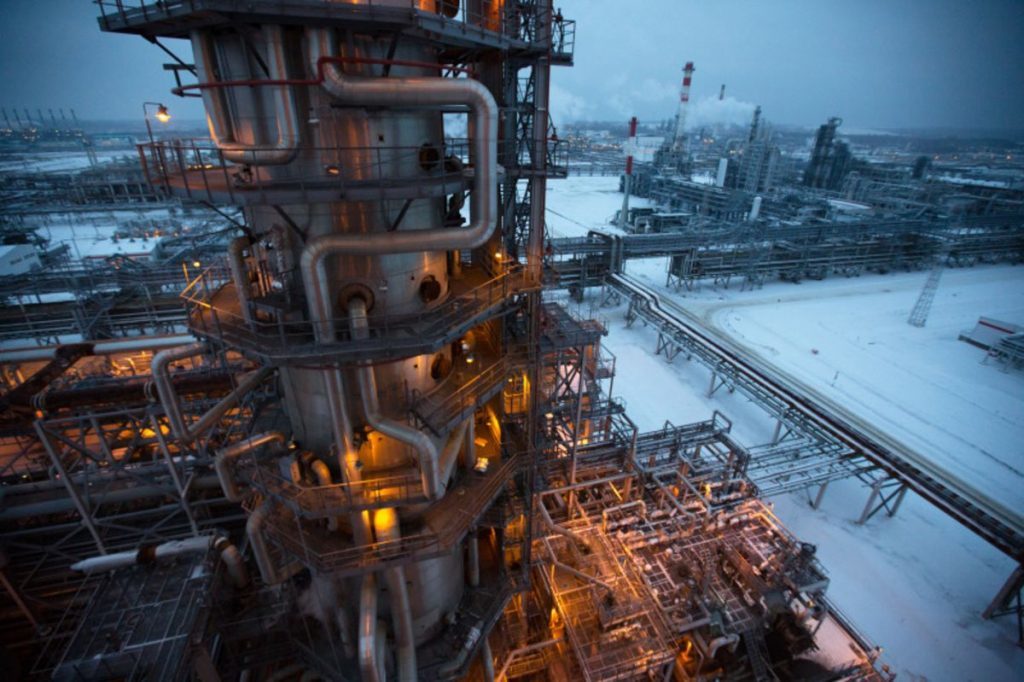 Electrical light illuminates a petroleum cracking tower at the Lukoil-Nizhegorodnefteorgsintez oil refinery, operated by OAO Lukoil, in Nizhny Novgorod, Russia. Photographer: Andrey Rudakov/Bloomberg