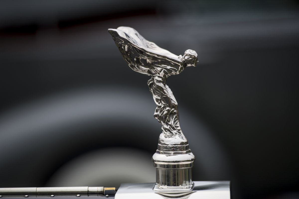 A 'Flying Lady' hood ornament sits on a 1914 Rolls-Royce Silver Ghost motor vehicle, manufactured by Rolls-Royce Motor Cars Ltd., during the 2016 Pebble Beach Concours d'Elegance in Pebble Beach, California, U.S., on Sunday, Aug. 21, 2016. Photographer: David Paul Morris